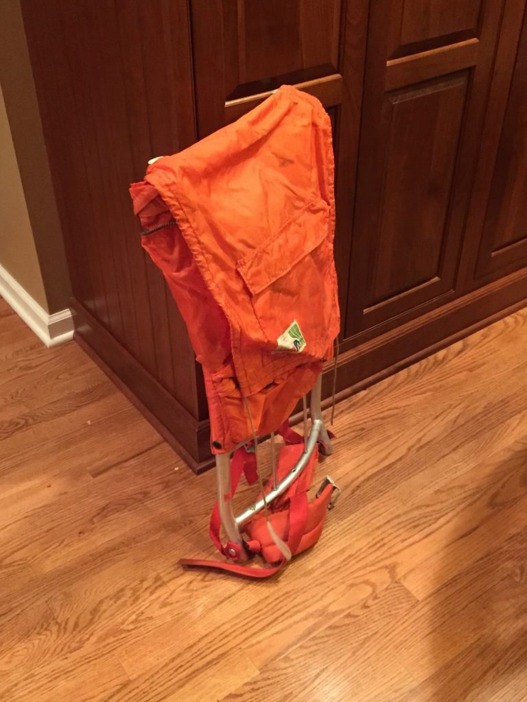 old worn orange backpack